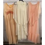 3 vintage 1970's chiffon angel sleeved maxi dresses in peach and cream colours. To include