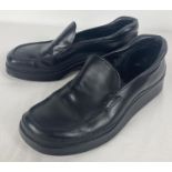 A pair of black leather chunky soled shoes by Prada. Size 7, in worn condition. Complete with