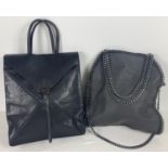 2 modern black leather handbags. A backpack style bag with toggle fastening together with a tote bag
