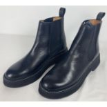 A pair of new boxed black leather chunky Chelsea boots by '& Other Stories'. With white stitched