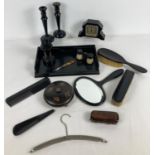 A collection of assorted vintage vanity items. To include ebony brush & mirror set, ebony dressing