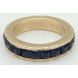 A heavy 14ct gold full eternity ring set with 22 square set blue sapphires. Gem stones approx. 2.2ct