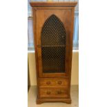 A Sheesham style rubberwood slimline cabinet with iron grill panelled front. Cupboard top with fixed