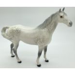 A Beswick ceramic Swish tail horse figure #1182, in grey gloss finish. First version with tail