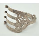 A silver bangle hand crafted from a decorative Victorian serving fork. Hallmarked Arron Hadfield,