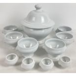 A collection of French porcelain white glazed table ware with lions head design handles. Comprising: