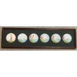 A framed and glazed set of 6 pen, ink and watercolour roundels "Country Cartoons" by Guy.