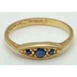 An 18ct gold and sapphire 3 stone ring with pointed oval shaped setting. Ring size N½, marked inside