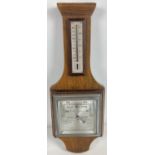 An Art Deco wooden barometer by Picketts & Pursers, Portsmouth & Southampton. Stamped number to
