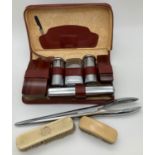 A vintage leather cased chrome and wood men's vanity set with zip fastening. Together with 2 small