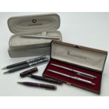 A collection of vintage and modern fountain pens and pencils. Comprising: matching ball point pen
