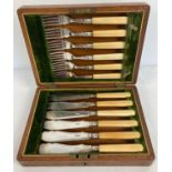 A vintage silver plated set of fish knives & forks in a period wooden case, set with brass cartouche