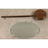 A vintage copper warming pan with dark wood handle, together with an oval shaped bevel edged hall