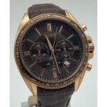 A men's Hugo Boss chronograph dress wristwatch with brown leather strap. Rose gold tone case with