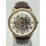 A Rotary Automatic skeleton wristwatch with brown leather strap. Gold tone case, hour markers and