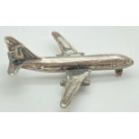 A 925 silver miniature model of an aeroplane. Stamped 925 and with worn hallmarks to underside.