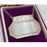 A boxed Art Deco style silver decanter label hallmarked Sheffield 1997. Total weight approx. 16.6g.
