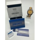 A Perpetual C Titanium wristwatch by Seiko. Grey titanium metal and yellow silicone strap with