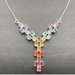 A modern design "Y" shaped fixed pendant necklace set with 24 oval cut semi precious stones in