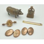 A collection of vintage small metal items. To include smal hollow bras pig, decorative brass fob,