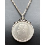 A silver Spanish 100 Ptas 1974 coin, in silver mount. On a 20 inch decorative belcher chain with
