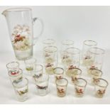 A quantity of assorted mid century glassware with transfer print detail. A tall pitcher decorated