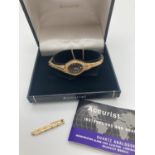 A vintage gold plated bracelet strap ladies wristwatch by Accurist. Complete with safety chain and