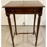 A small reproduction dark wood occasional table with central drawer and turned legs and