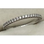 An 18ct white gold, diamond set half eternity ring. Fully hallmarked inside band. Ring size L, total