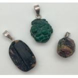 3 natural stone pendants with silver bales. To include a carved malachite pendant and oval cut black