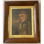 A 19th century oil painting of a Dutch gentleman drinking from a tankard. In dark wood frame and