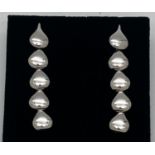 A pair of Designer silver earrings with articulated teardrop links. Fully hallmarked to reverse with