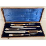 A Victorian Mappin & Webb silver mounted 5 piece carving set. One set for large meats and one for