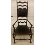 A Victorian mahogany ladder backed chair with studded leather effect seat & back cushion. Turned