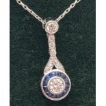 An Art Deco style 18k white gold diamond and sapphire set necklace. Very fine belcher chain with