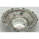 An Edwardian silver bon bon dish with pierced work detail and scroll & foliate design to rim.