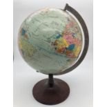 A vintage 1972 Scan Globe A/S, Denmark globe on circular shaped stand. Approx. 35cm tall.