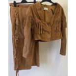 A tan brown vintage suede bolero style jacket with fringe detail to front, arms and back, by