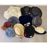 A collection of assorted theatre costume hats in varying styles and colours.