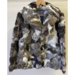 A vintage 1980's "Joan Collins" multi coloured rabbit fur jacket with front pockets and hook and eye