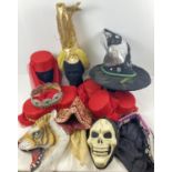 A collection of assorted theatrical costume hats, in varying styles.