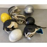A collection of assorted theatre costume and vintage helmets.