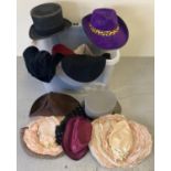 A box of assorted theatre costume hats in varying styles, colours and sizes.