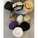 A box of assorted theatrical hats in assorted styles and sizes.