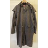 A mens long brown wax coat with cape detail to shoulders and hood, by Blue Riband. Front zip and