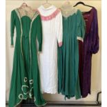 4 vintage theatre company period style dresses, in varying colours and styles.