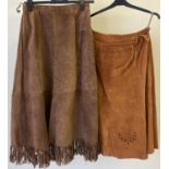 2 vintage 1980's A line style brown suede skirts. A dark brown skirt with fringe detail to hem,