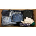 A large box of assorted womens denim jeans and trousers.