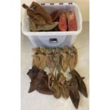 A large box of men's and women's shoes & boots in brown tones. Mostly ankle pixie boots. In