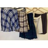 5 vintage ladies skirts in varying sizes and designs. To include: blue and white check pleated